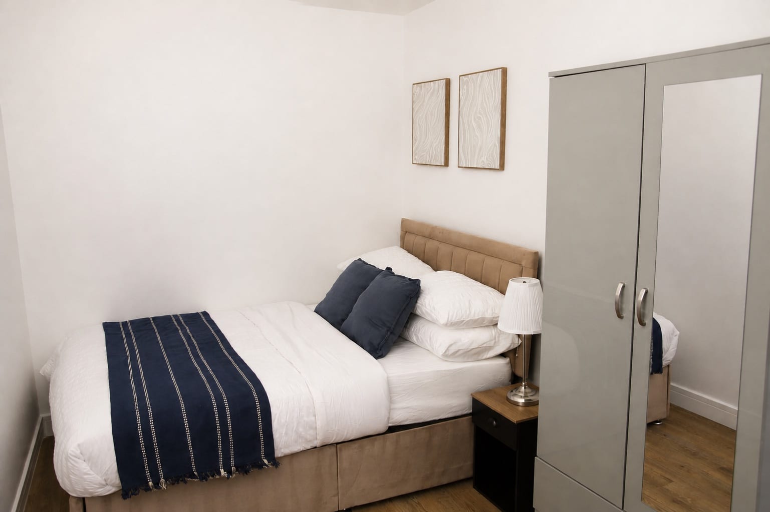 Illustrative comfortable bedroom with bedside lighting