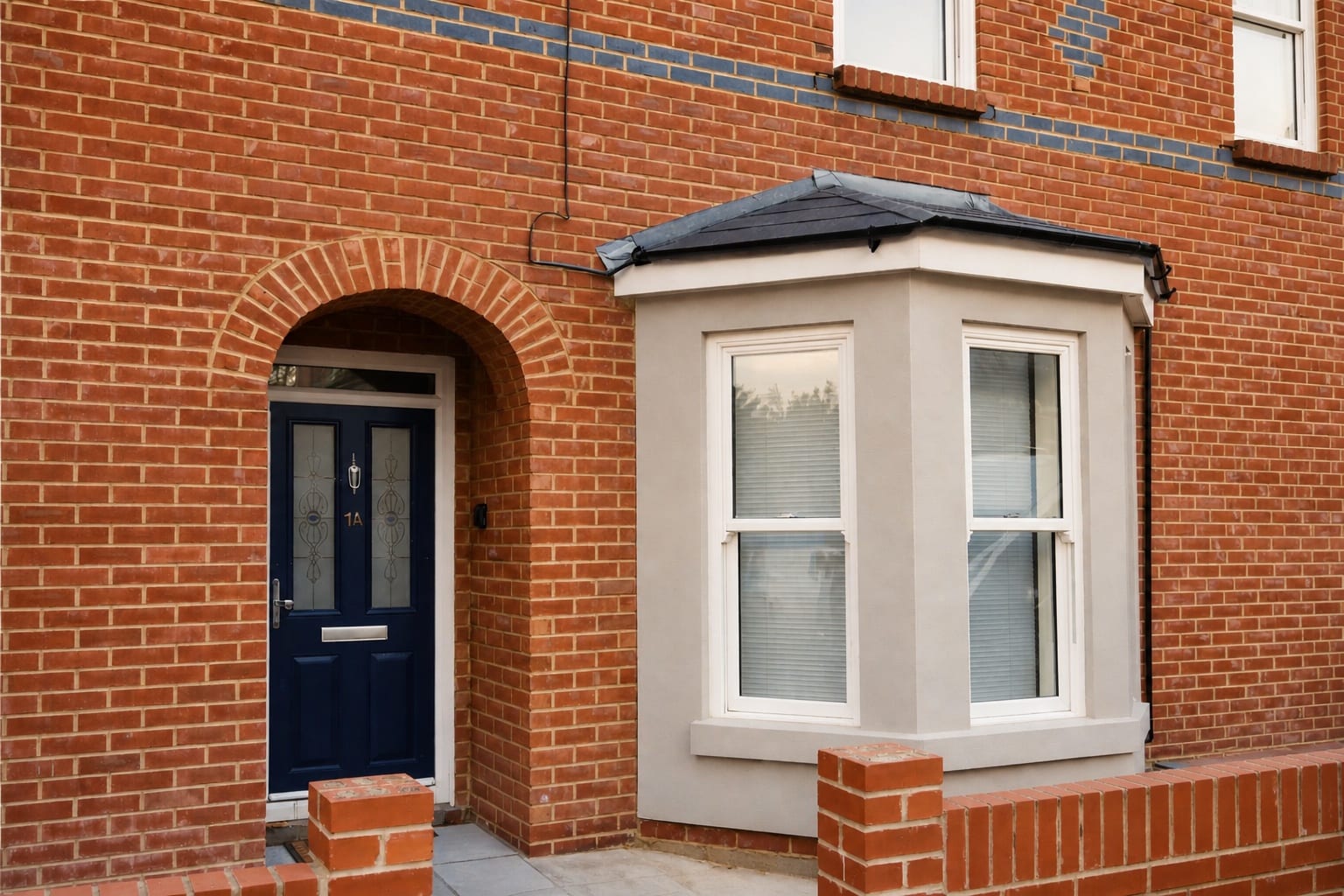 Illustrative brick home exterior representing a welcoming arrival